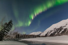 Multicolored Aurora lights up the the night sky over the open water of  Portage Creek.  March 7, 2012.