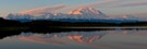 A rare, clear sky sunrise on Denali (Mt.. Mckinley) reflecting in Reflection Pond.